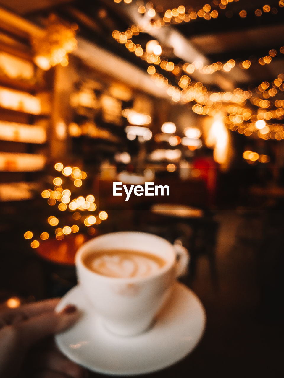 Coffee cup on table in cafe