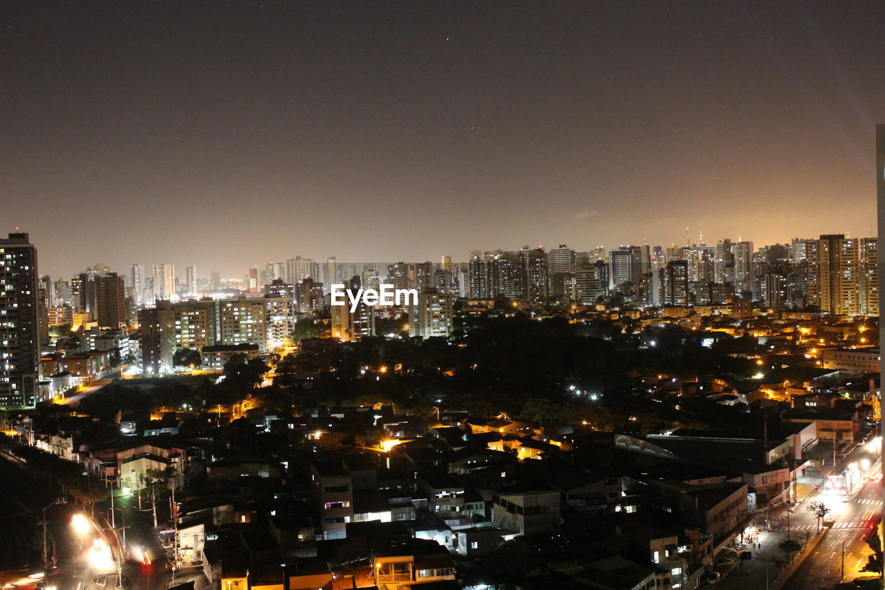 Illuminated buildings in city at night