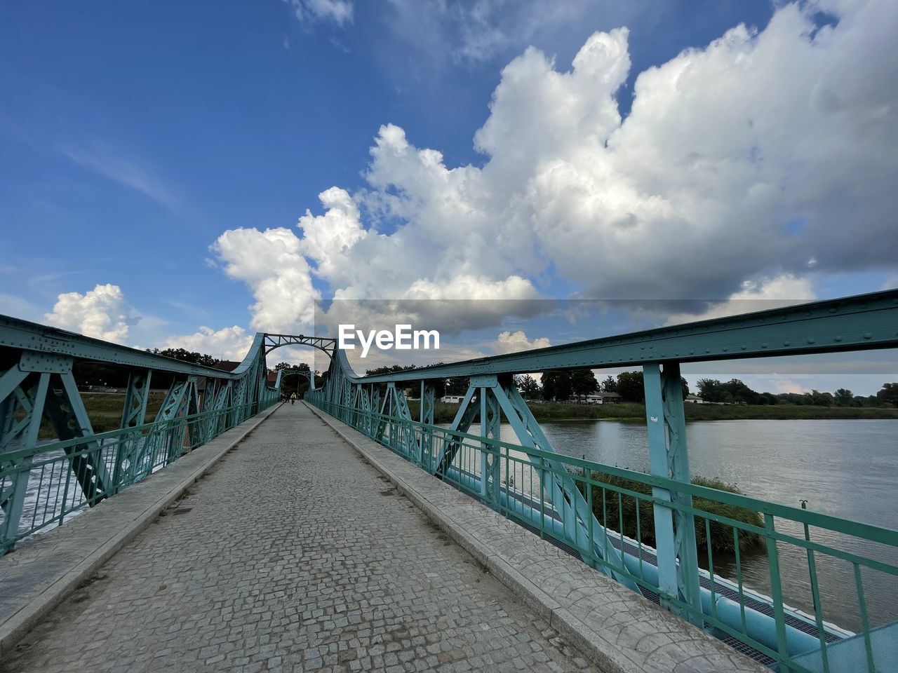 VIEW OF BRIDGE OVER RIVER AGAINST SKY
