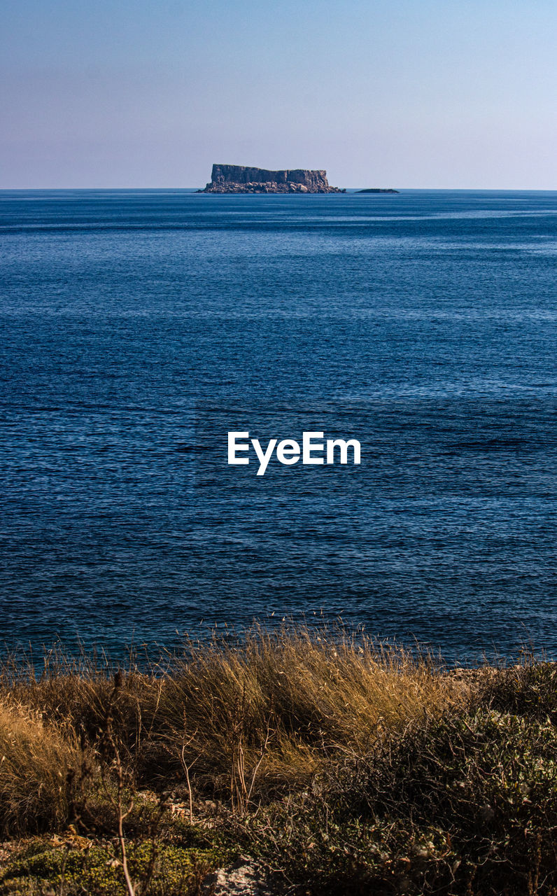 Scenic view of sea against clear sky