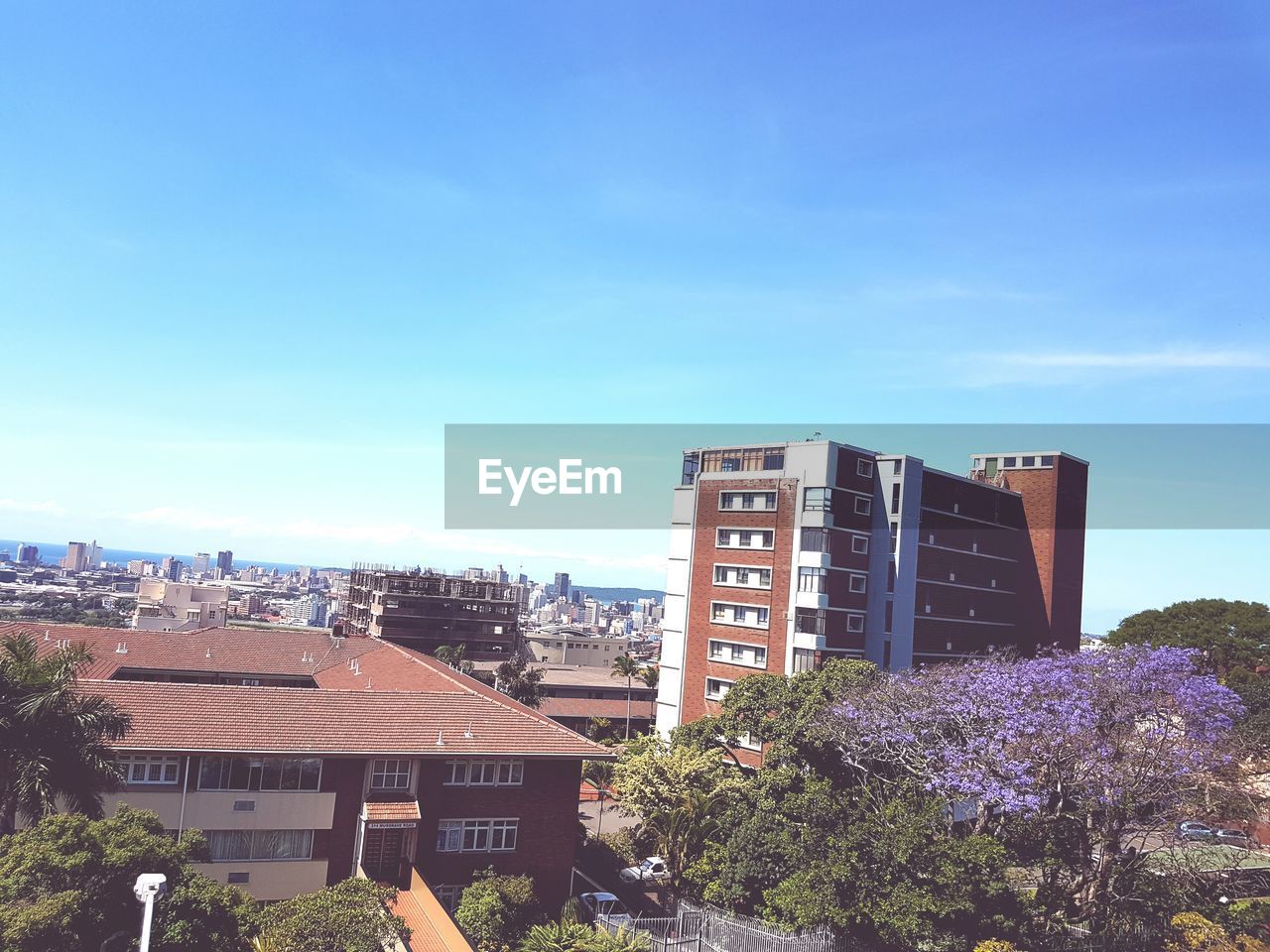 TALL BUILDINGS AGAINST BLUE SKY