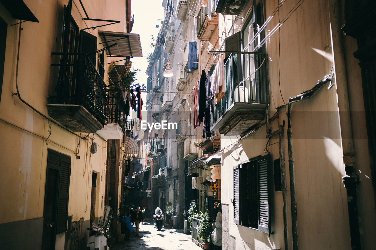 Narrow street amidst buildings in town