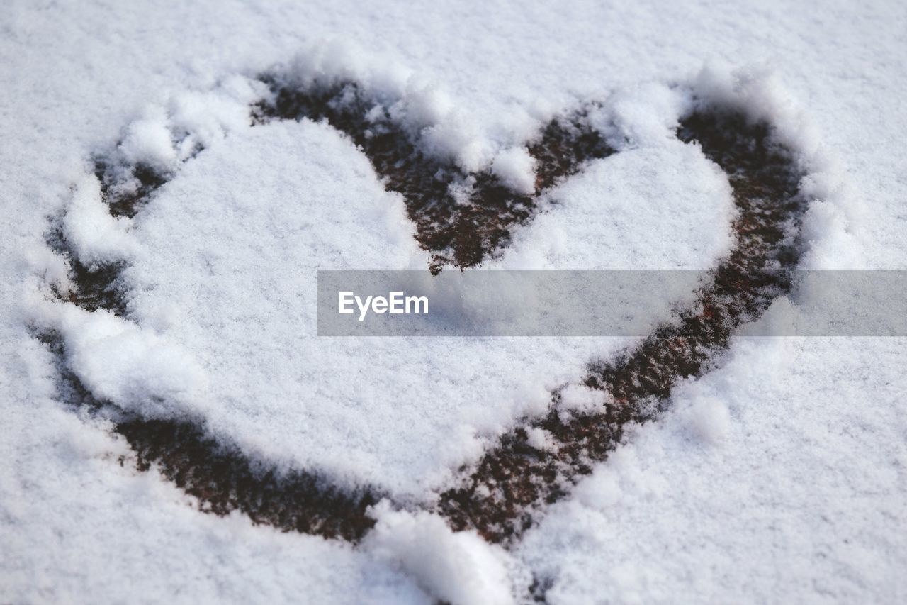 High angle view of heart shape on snow