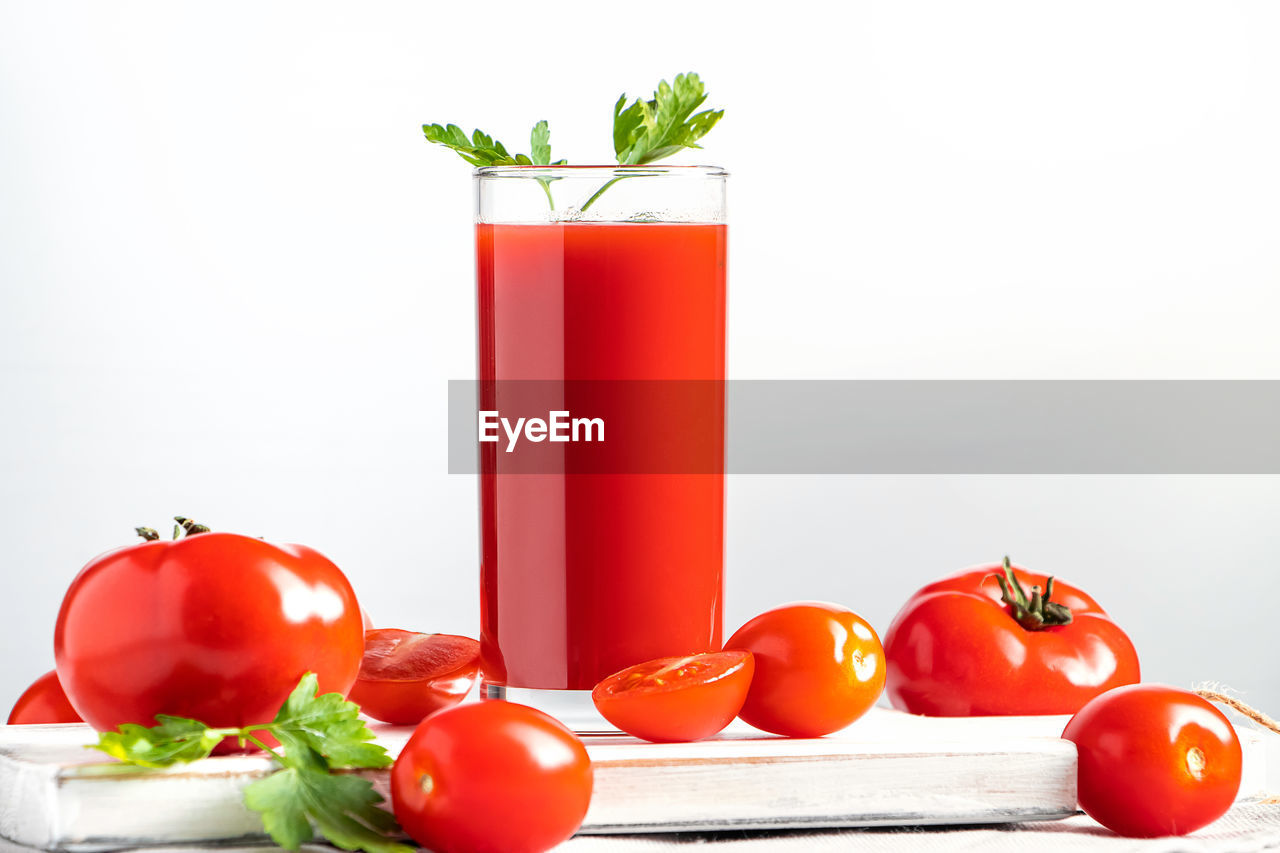 high angle view of fruits on table against white background