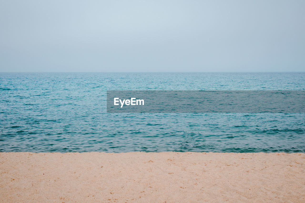 SCENIC VIEW OF BEACH AGAINST CLEAR SKY