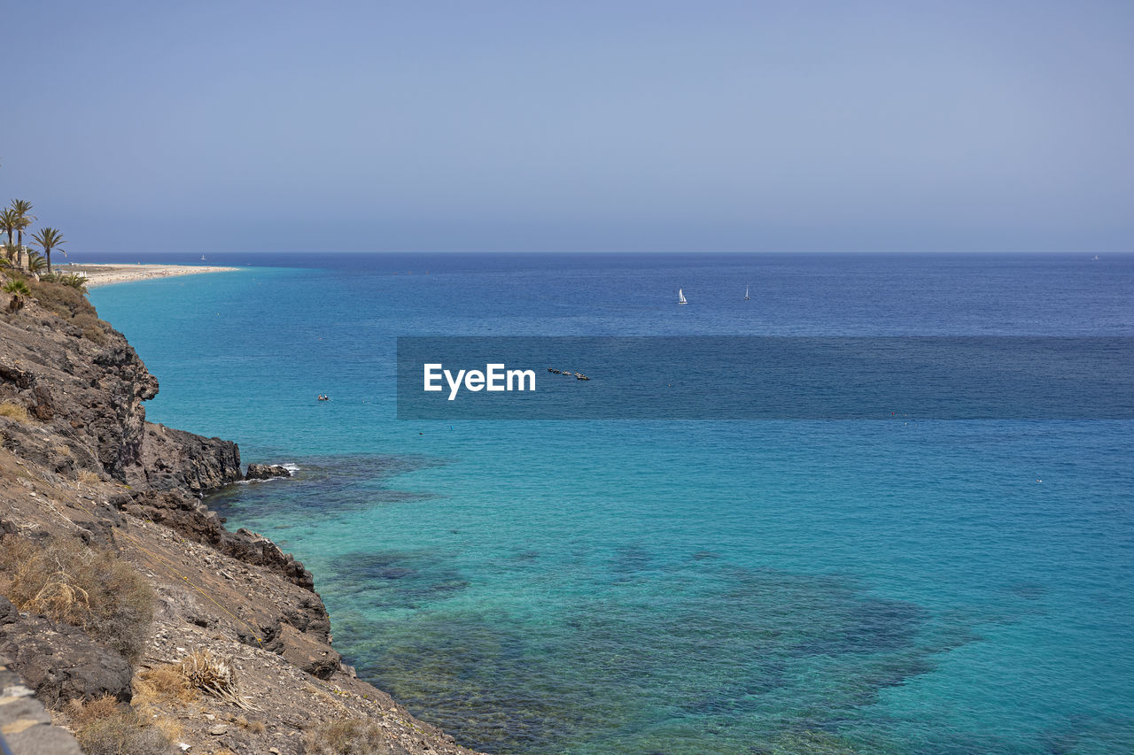 Scenic view of sea against clear sky