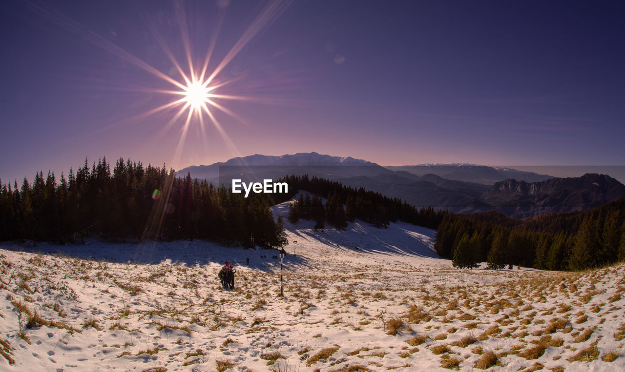 scenic view of snow covered mountains against sky