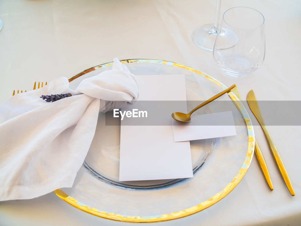 high angle view of wedding rings in plate on table