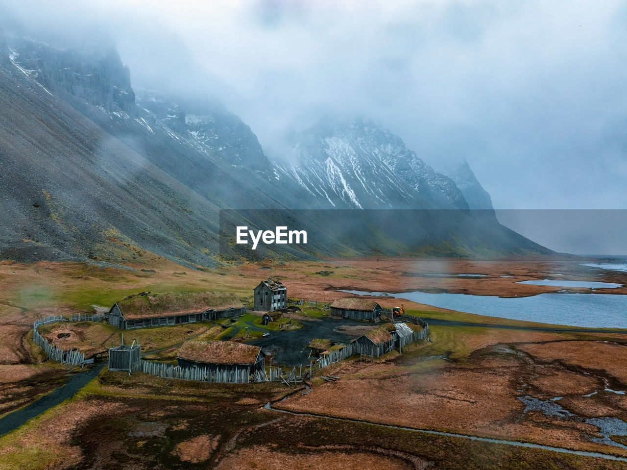 Aerial view of a viking village on a stormy rainy day in iceland.