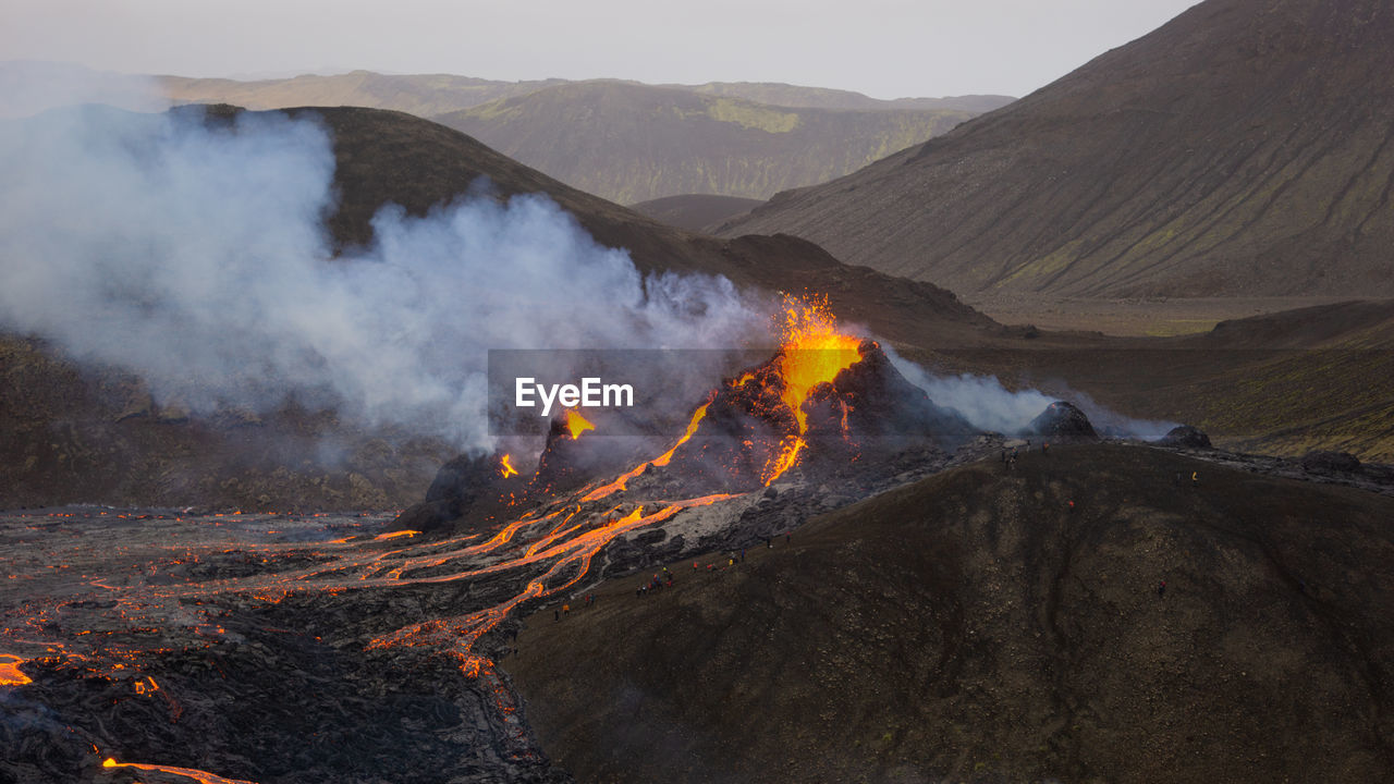 Smoke emitting from volcanic mountain at night