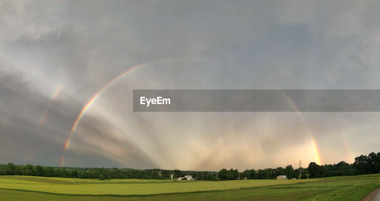 SCENIC VIEW OF RAINBOW OVER LANDSCAPE