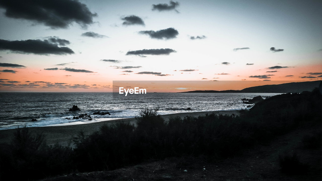 Scenic view of sea against sky during sunset