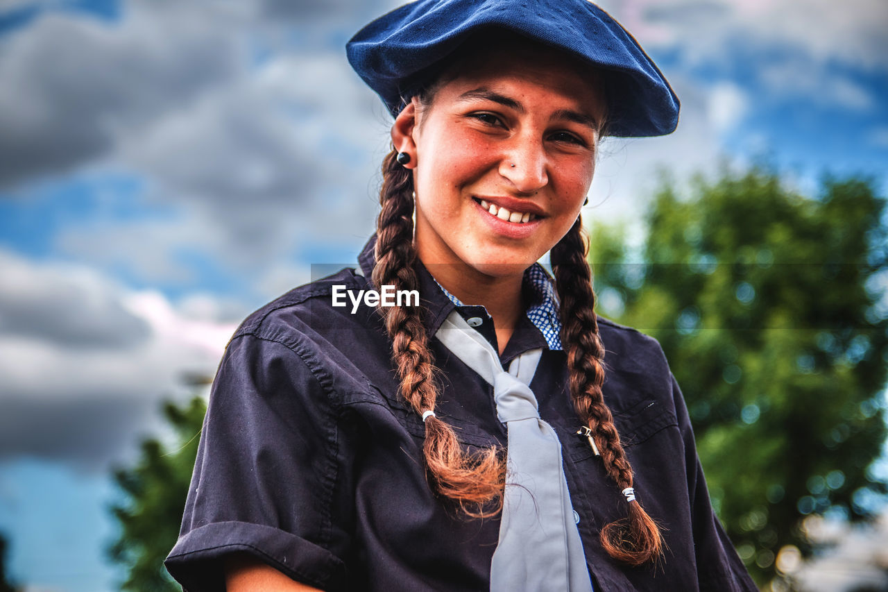 Portrait of smiling teenage girl wearing beret