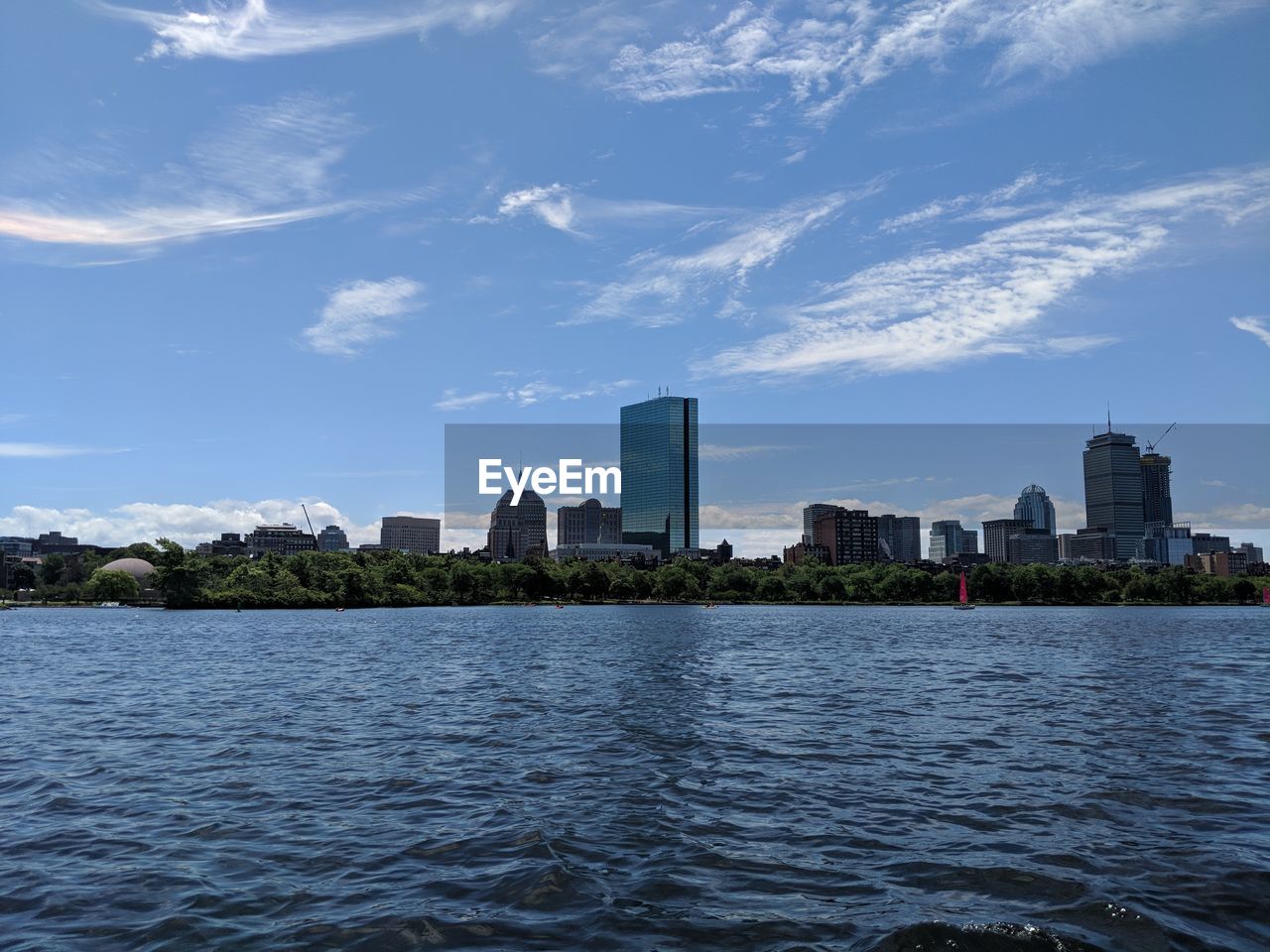 BUILDINGS BY SEA AGAINST SKY