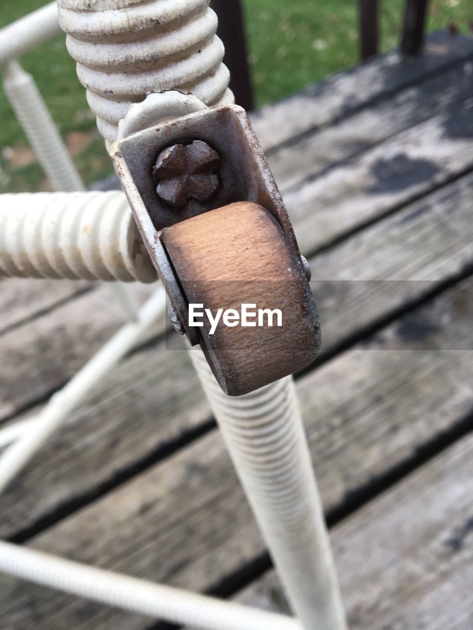 CLOSE-UP OF HUMAN HAND WITH WOOD