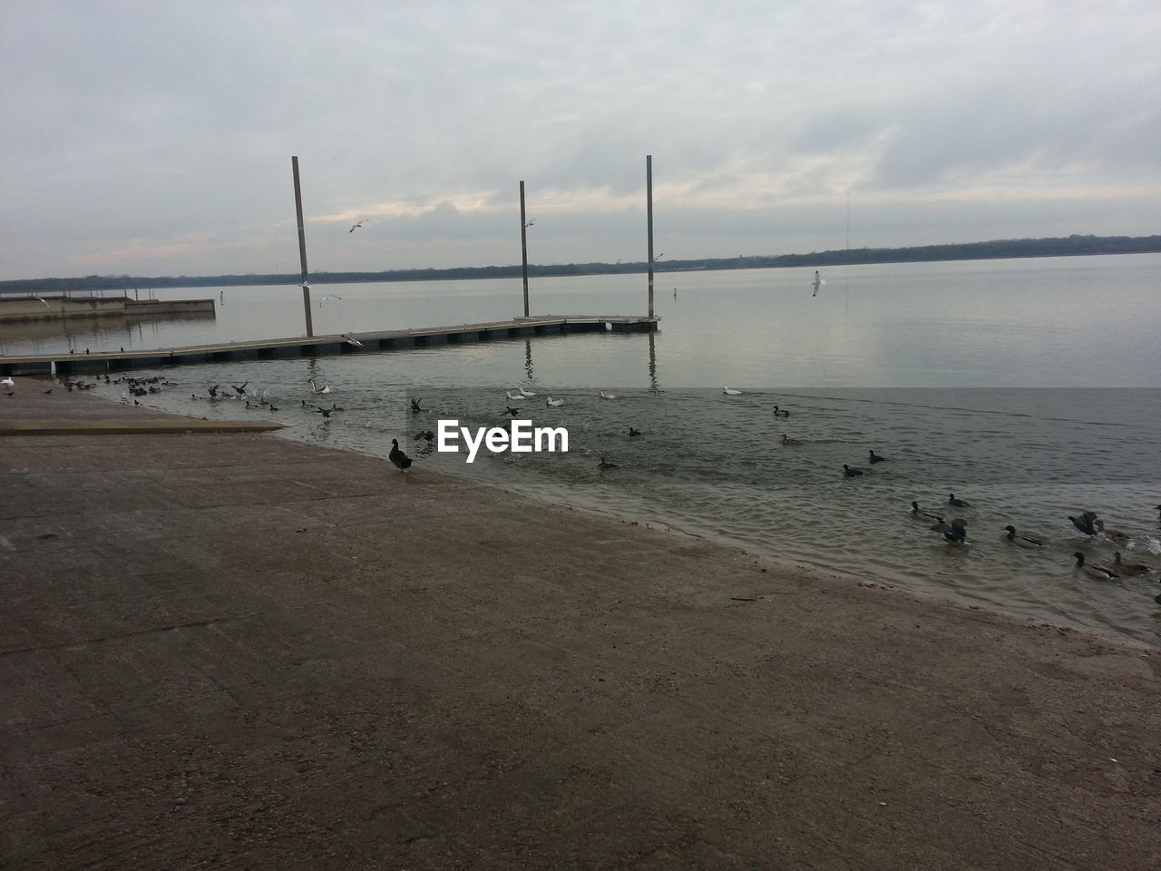 VIEW OF WATER AGAINST CLOUDY SKY