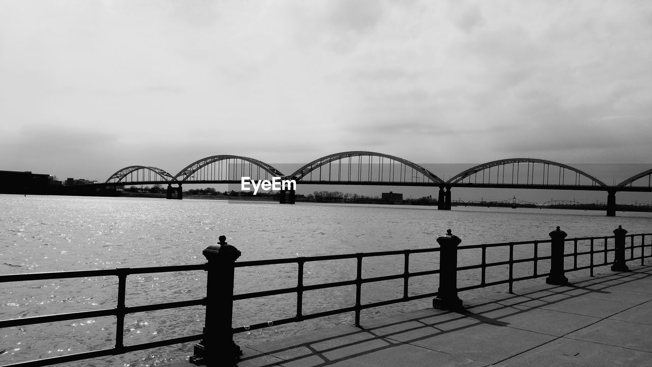 Rock island centennial bridge over mississippi river against sky