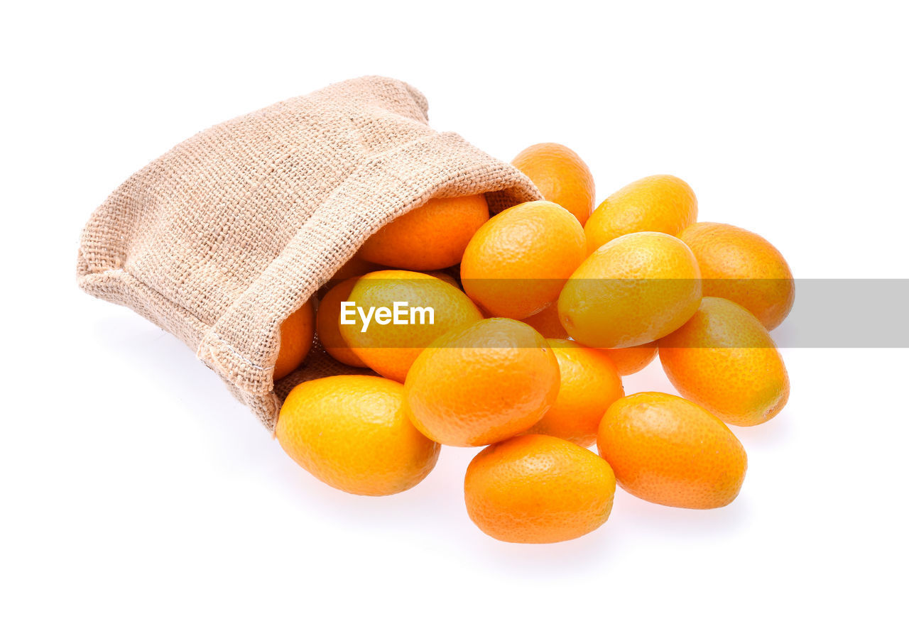 Close-up of oranges against white background