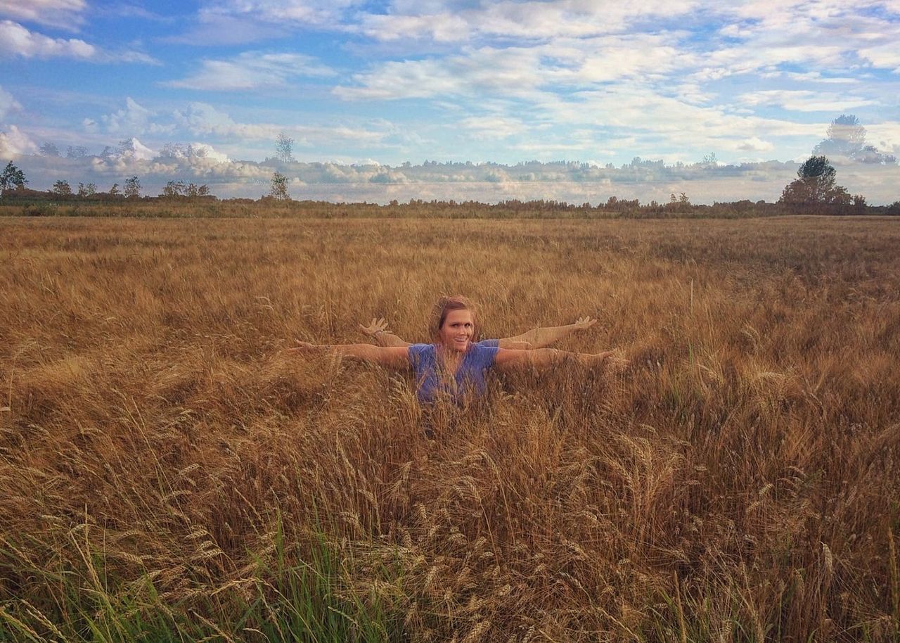 WOMAN STANDING ON FIELD