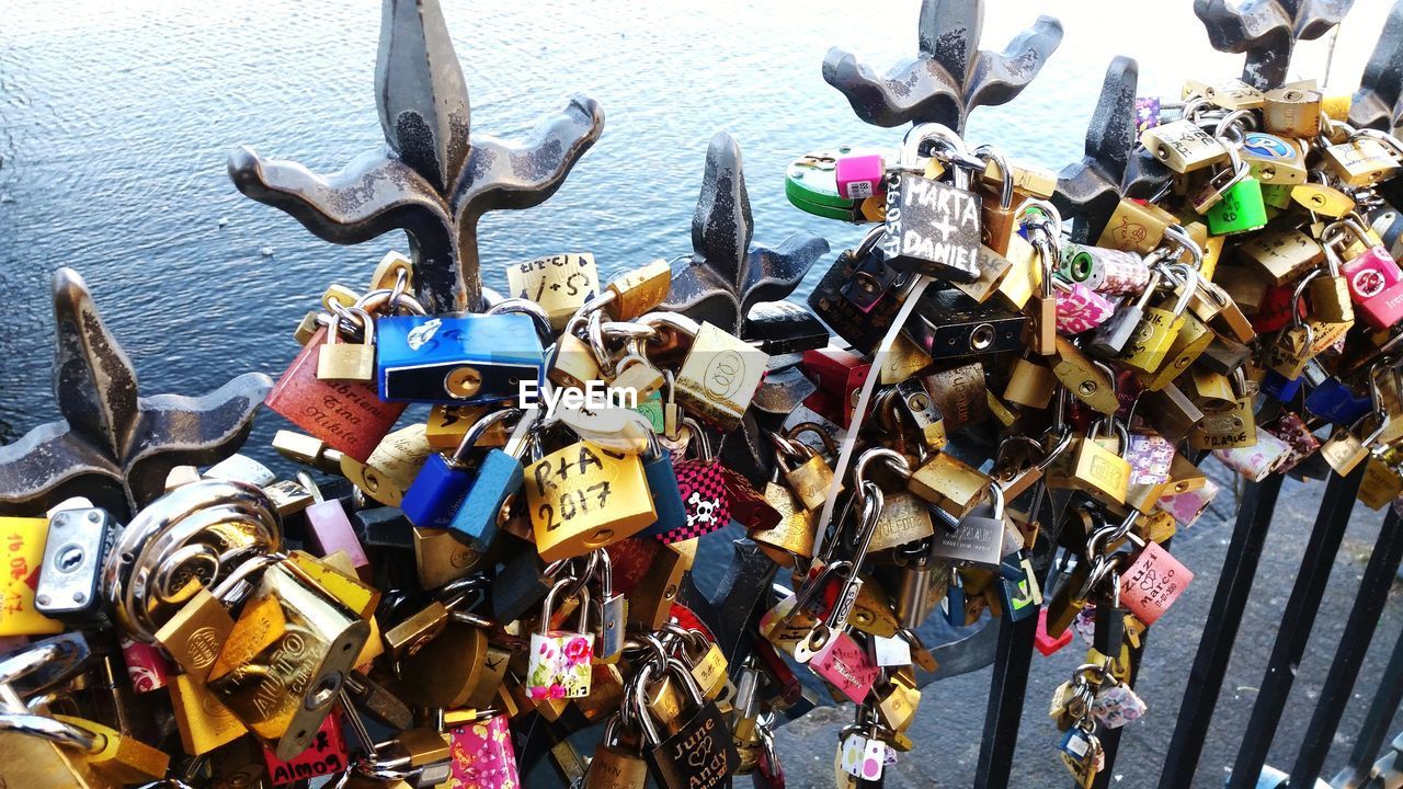 PADLOCKS ON RAILING AGAINST FENCE