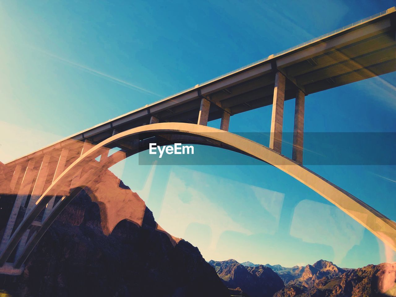 Low angle view of arch bridge against sky