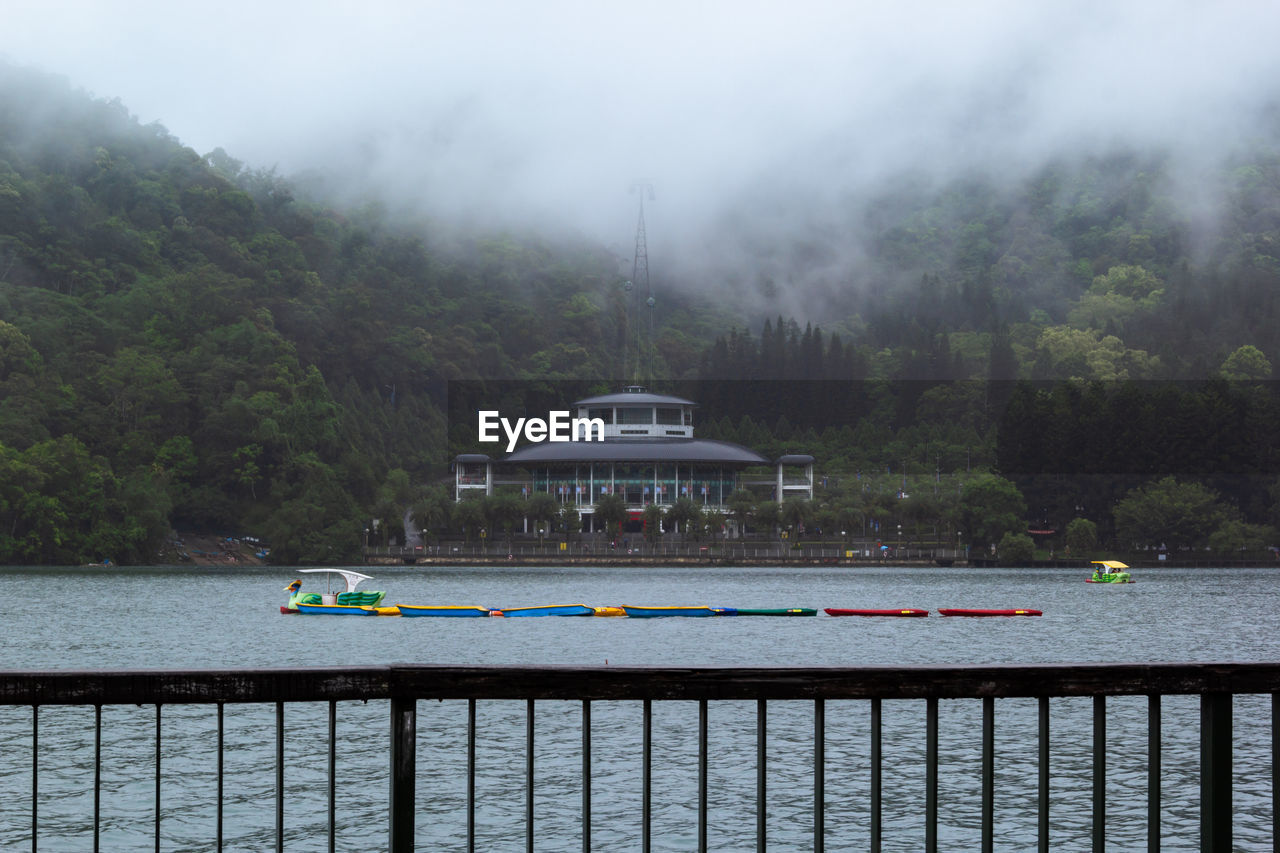 Scenic view of sun moon lake with fog