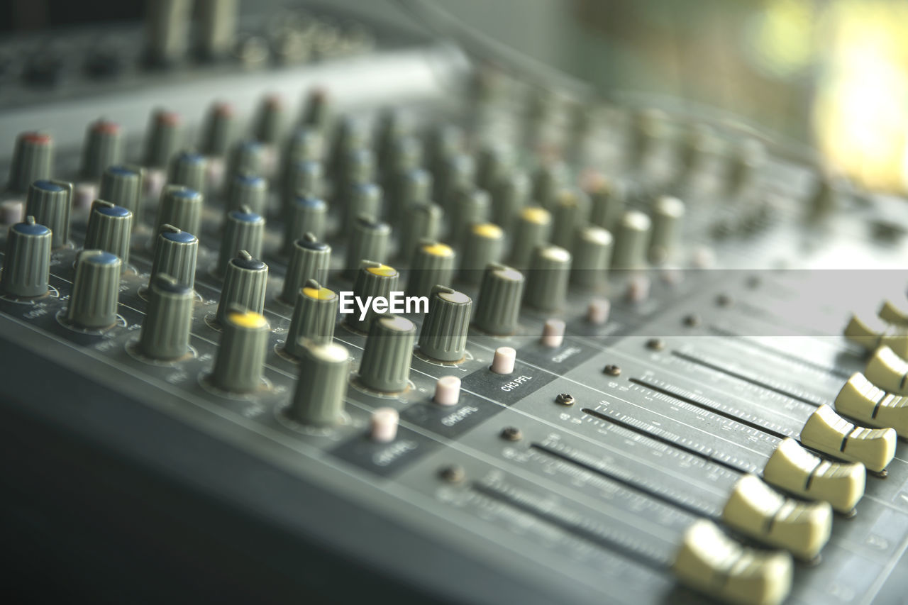 CLOSE-UP OF SOUND MIXER AT HOME