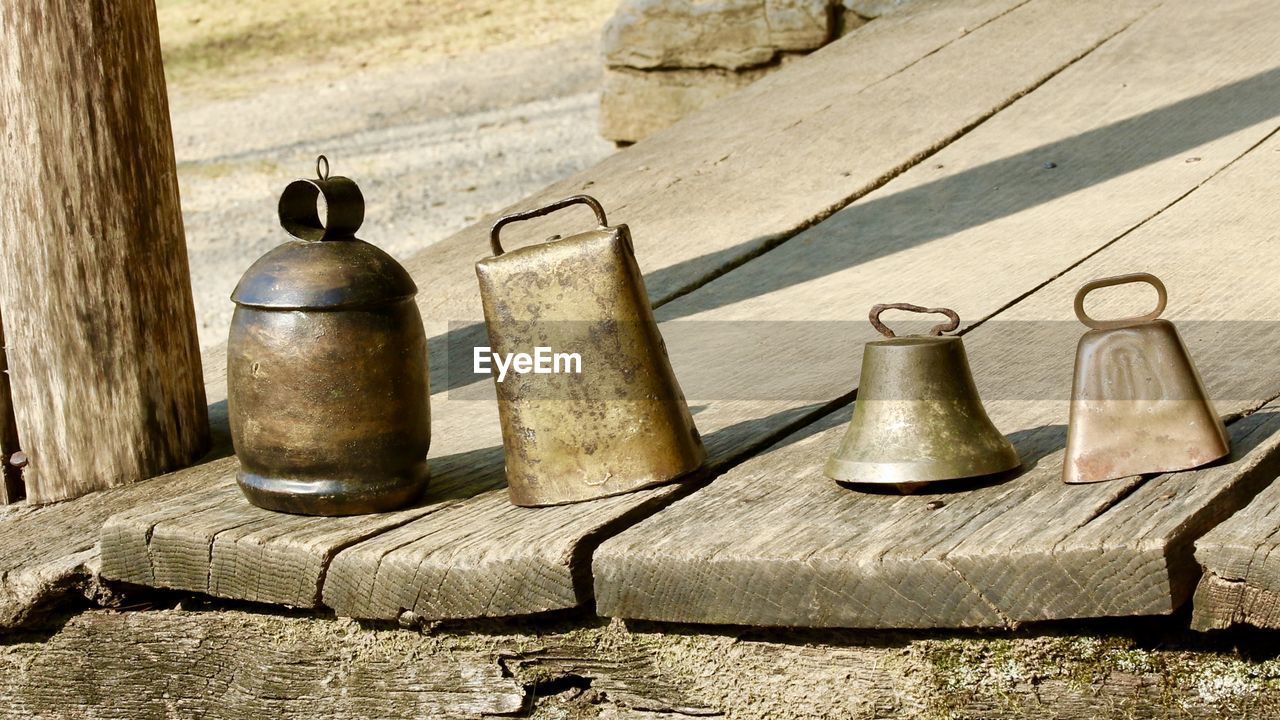 CLOSE-UP OF OLD BOTTLES ON TABLE