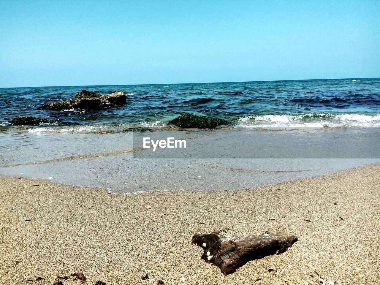 Scenic view of sea against clear sky