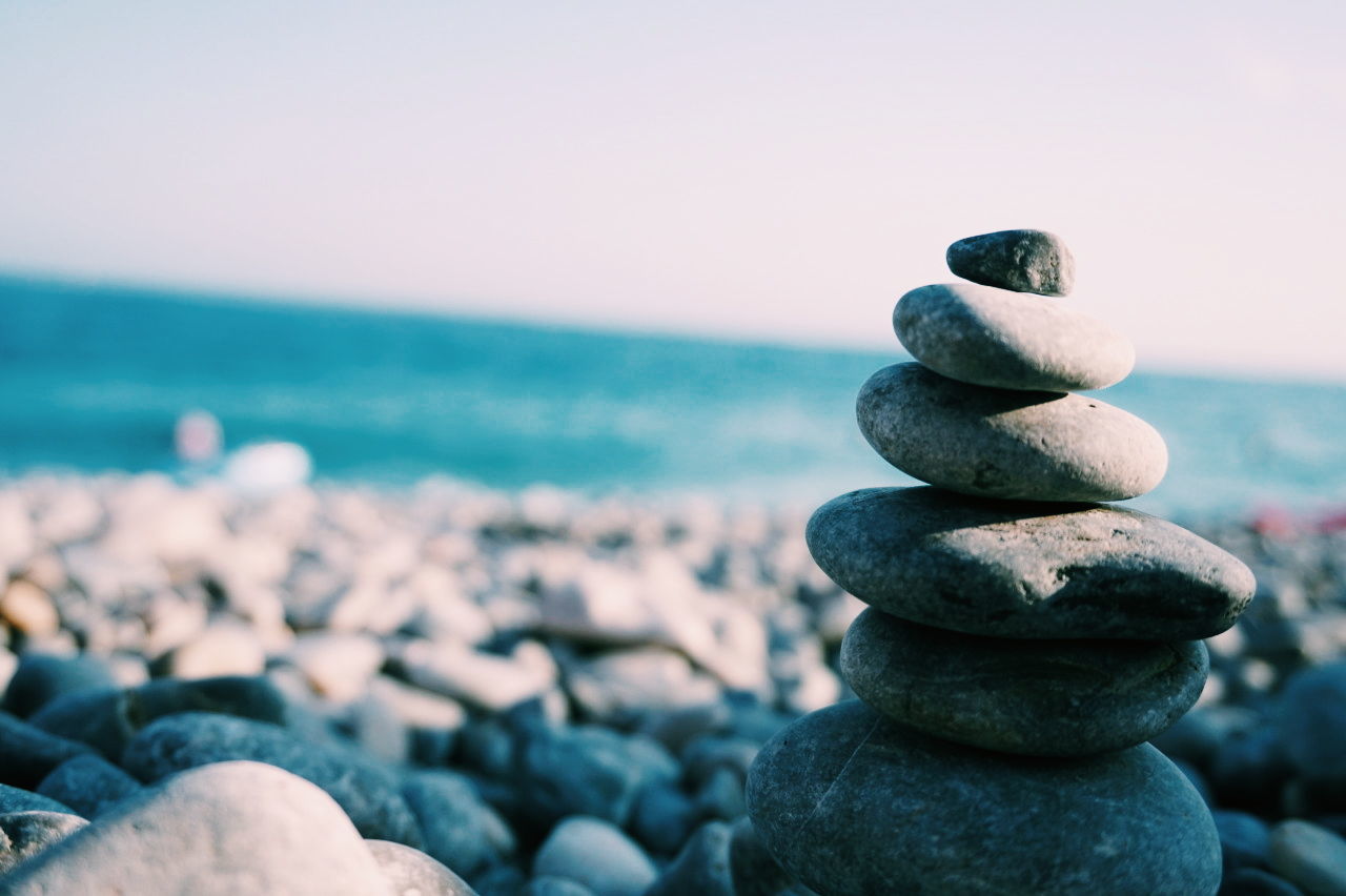 Close-up of pebbles on beach against sky