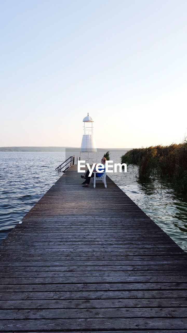 PIER OVER SEA AGAINST SKY