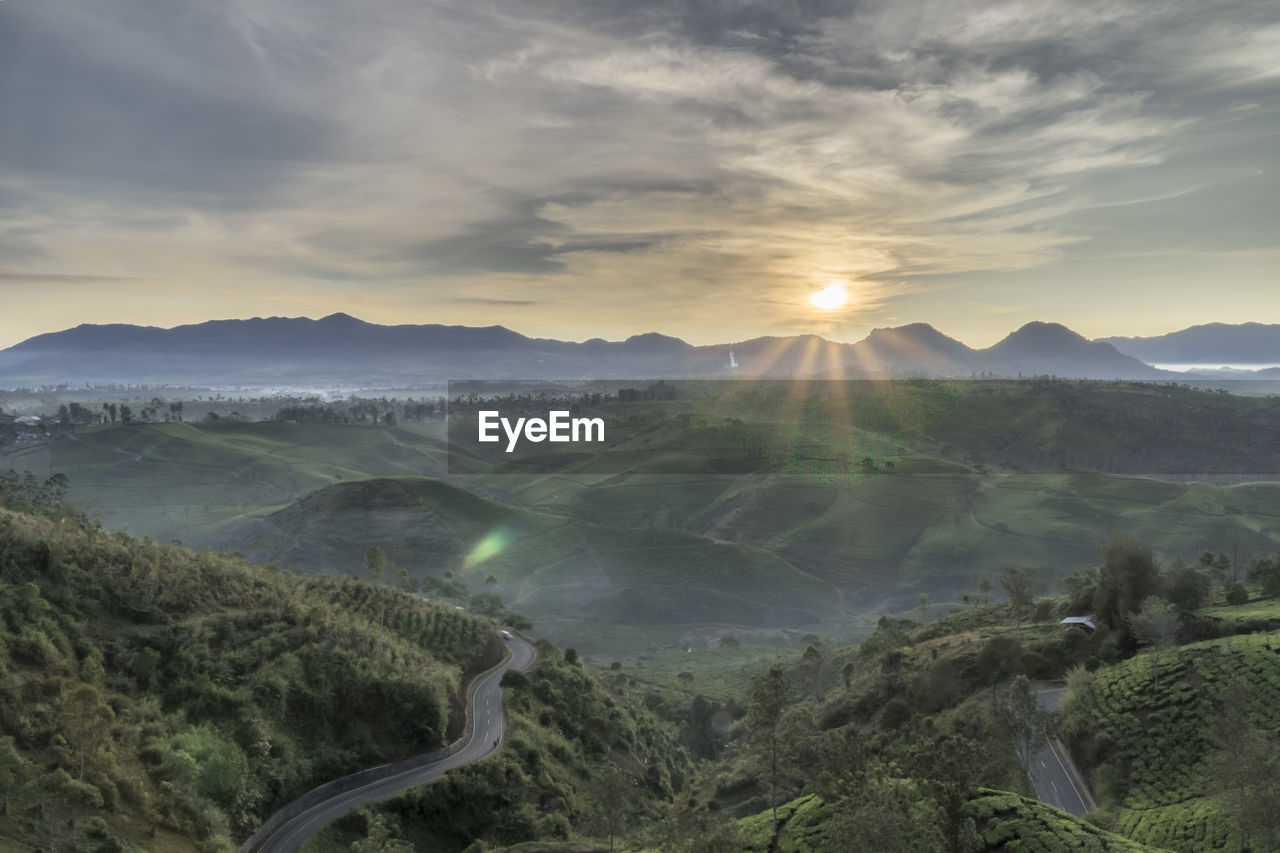 Scenic view of landscape against sky during sunset