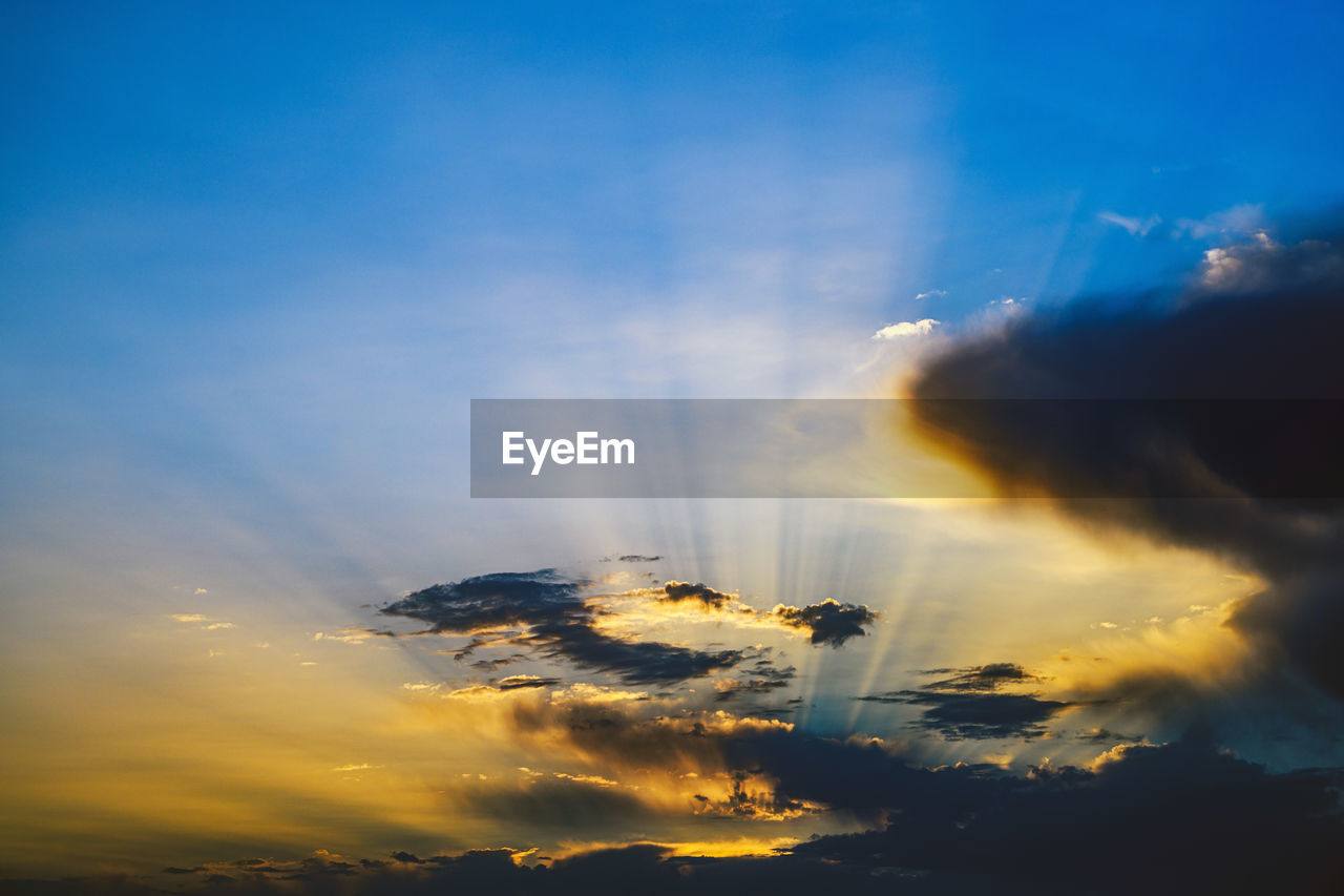 Low angle view of silhouette crane against sky during sunset