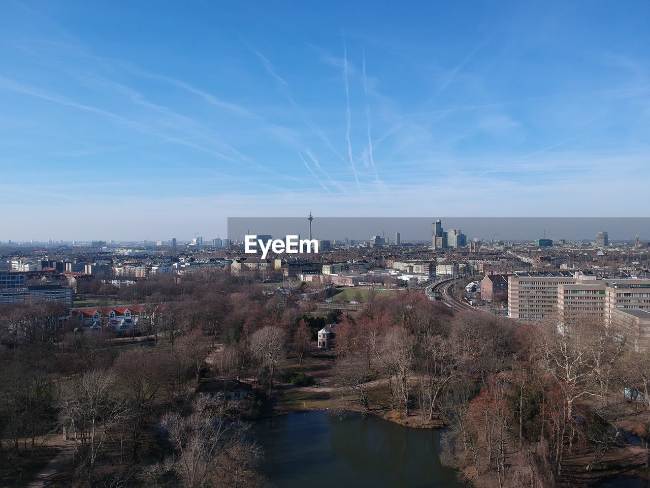 High angle view of river and buildings against sky