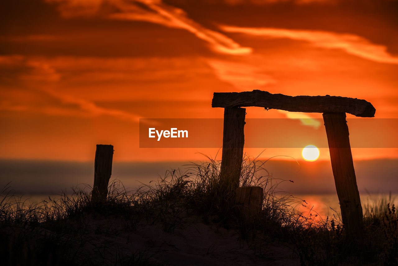 scenic view of beach against sky during sunset