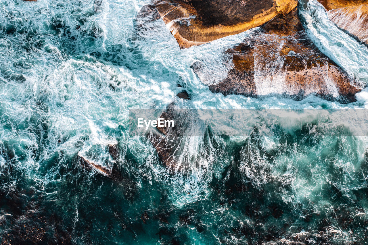 Sea waves splashing on rocks