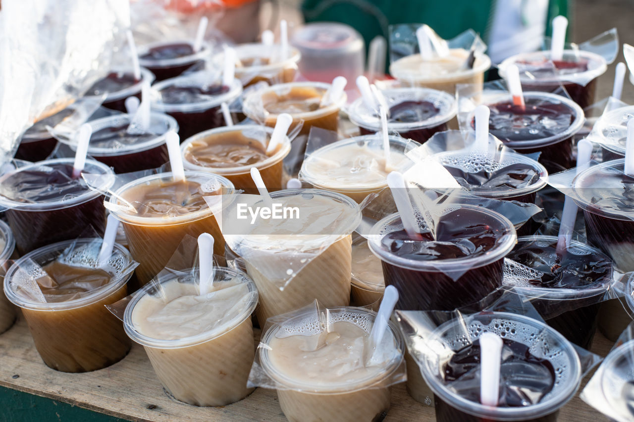 food and drink, meal, food, large group of objects, abundance, market, no people, retail, variation, market stall, business, for sale, dessert, container, high angle view, freshness, business finance and industry, still life, arrangement, table, day