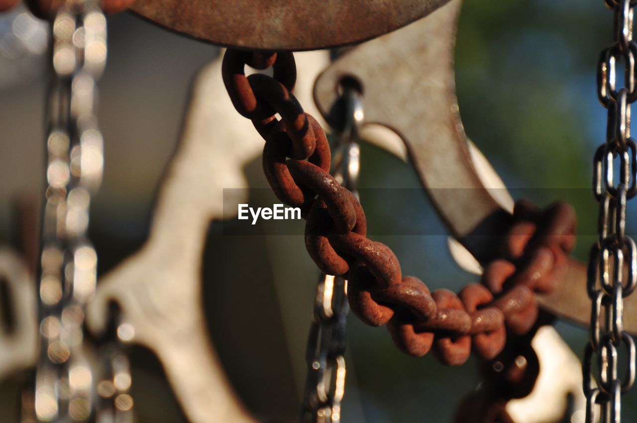 Close-up of chain hanging on metal