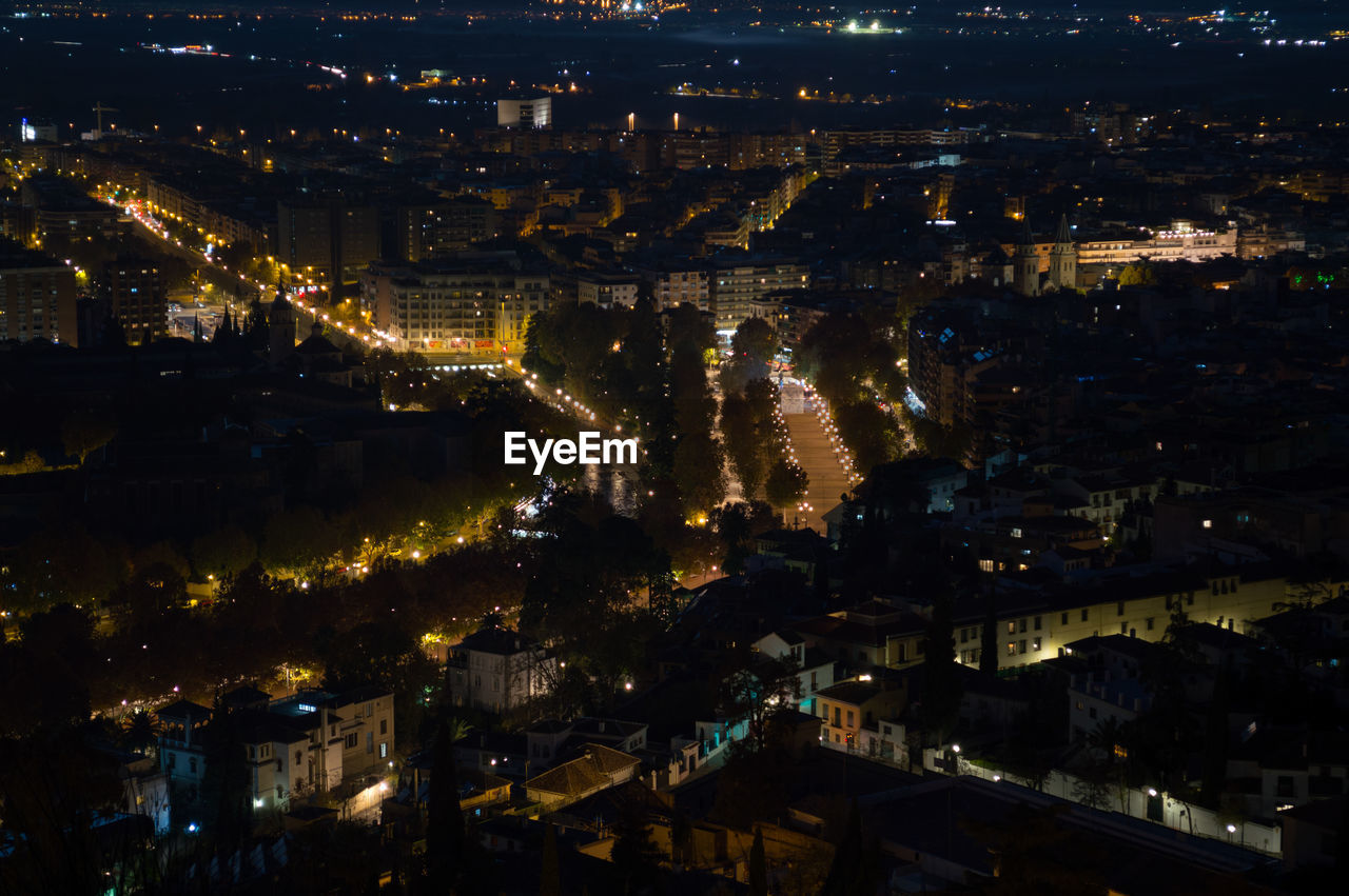 HIGH ANGLE SHOT OF ILLUMINATED CITYSCAPE