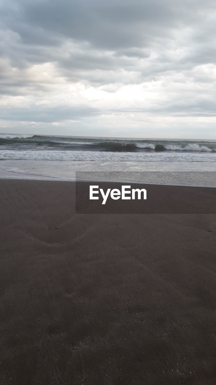 SCENIC VIEW OF SEA SHORE AGAINST SKY