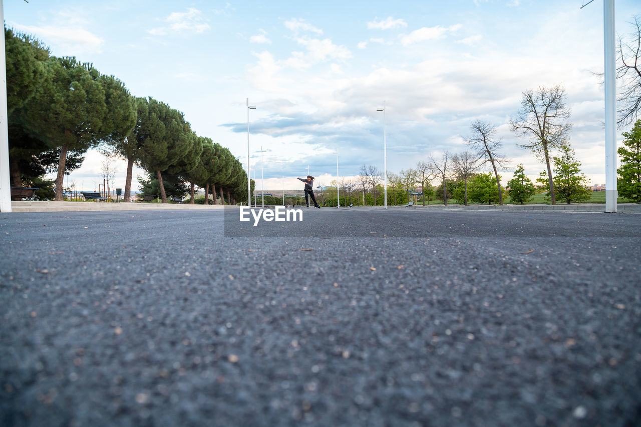 SURFACE LEVEL VIEW OF ROAD AGAINST SKY