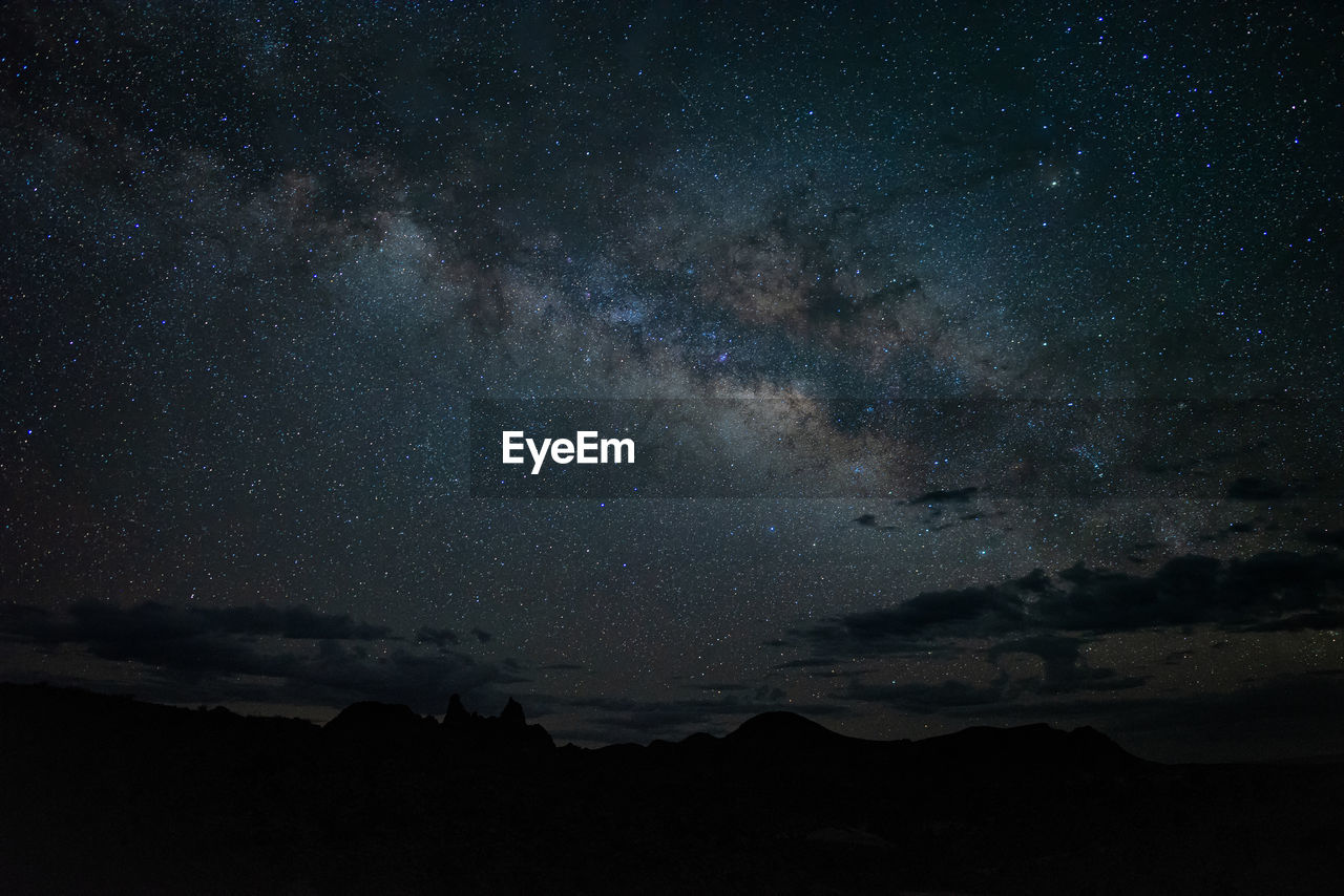 Low angle view of silhouette landscape against star field at night in big bend national park - texas