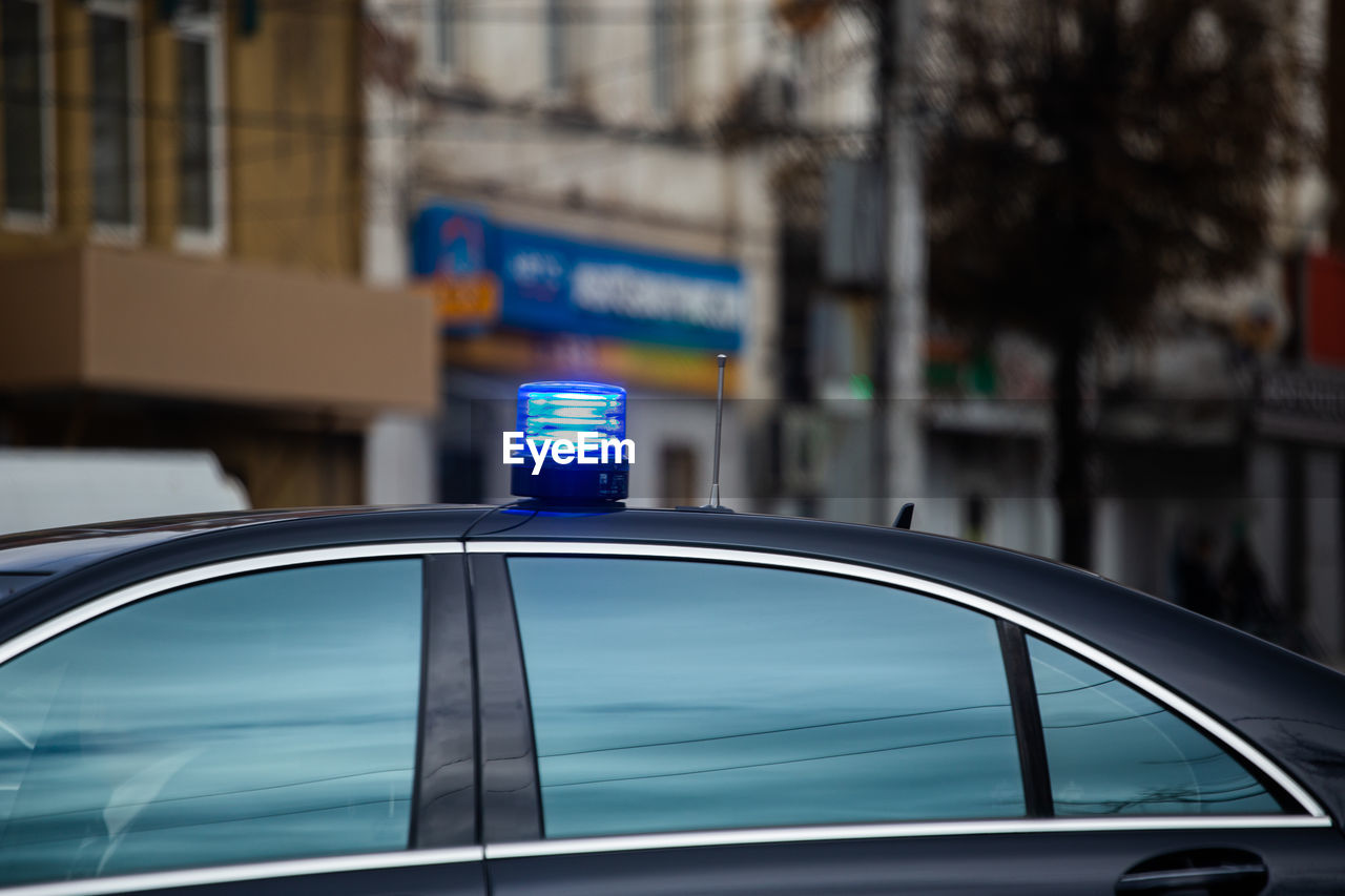 Illuminated light on car in city