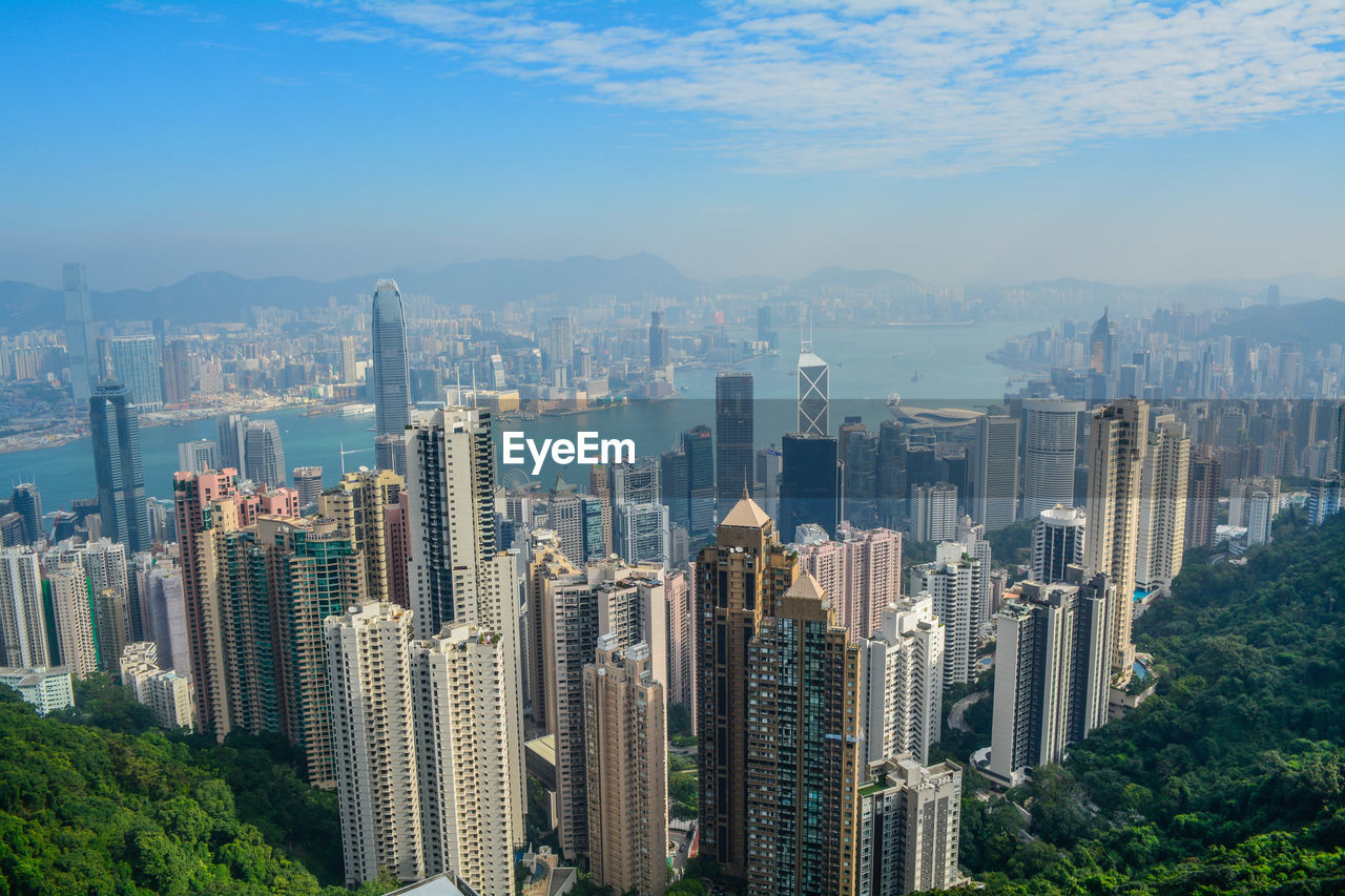 Aerial view of modern buildings in city against sky