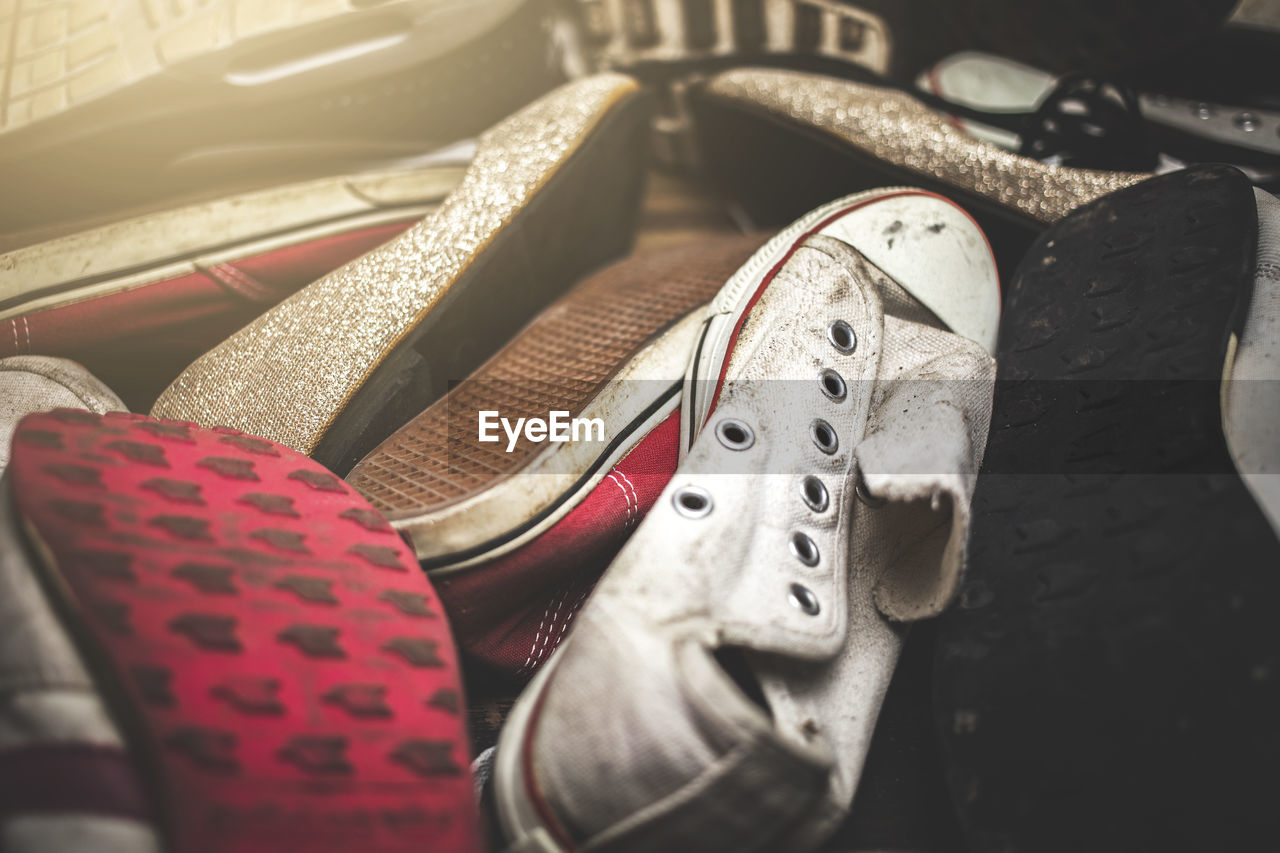 Close-up of dirty shoes on table