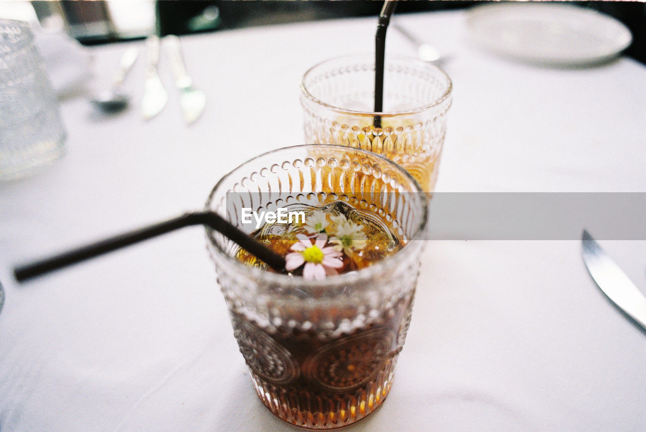 food and drink, food, glass, table, household equipment, drink, drinking glass, freshness, meal, dessert, soft drink, indoors, refreshment, no people, sweet food, kitchen utensil, sweet, eating utensil, close-up, healthy eating, high angle view