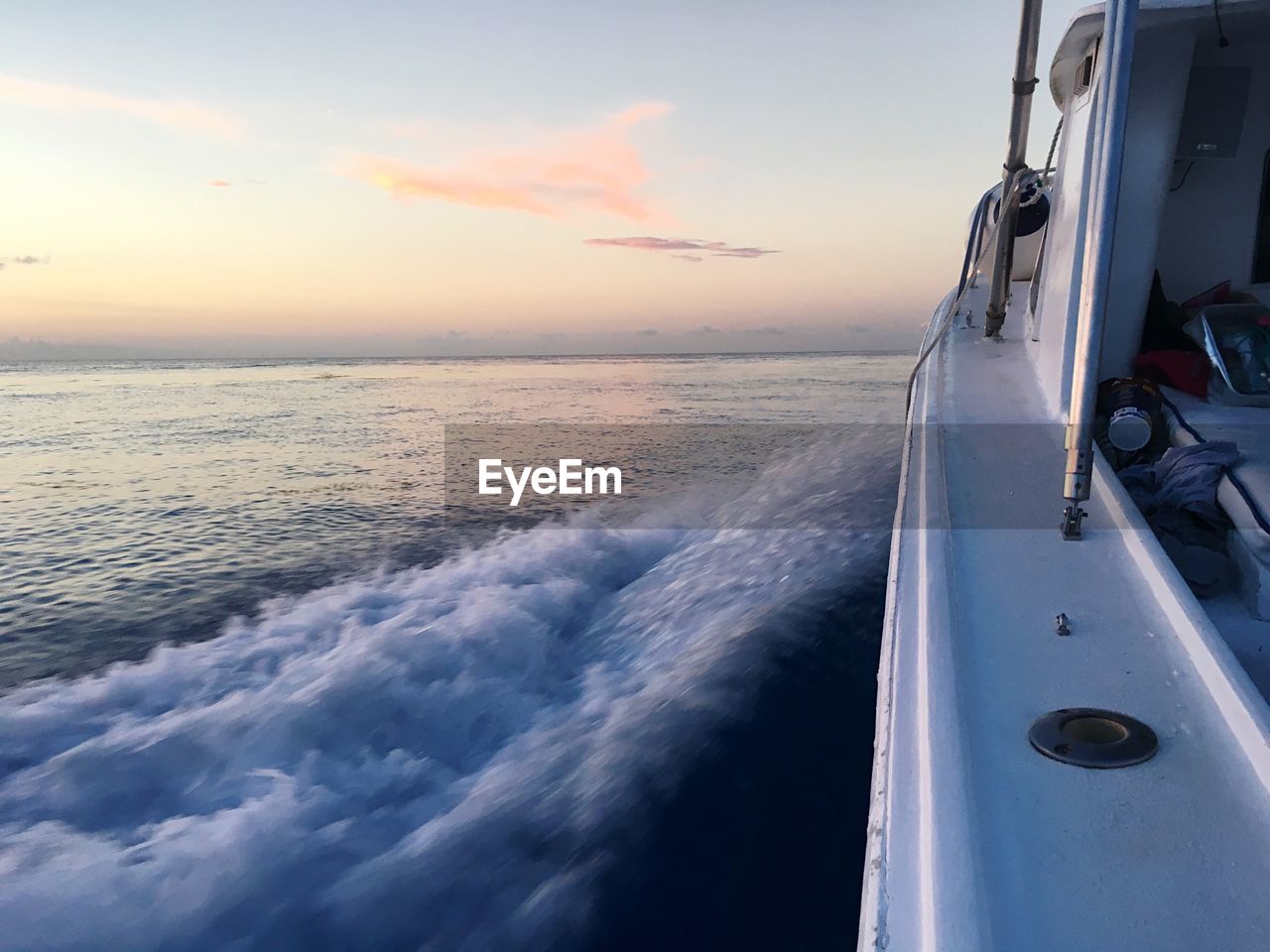 Close-up of sea against sky during sunset