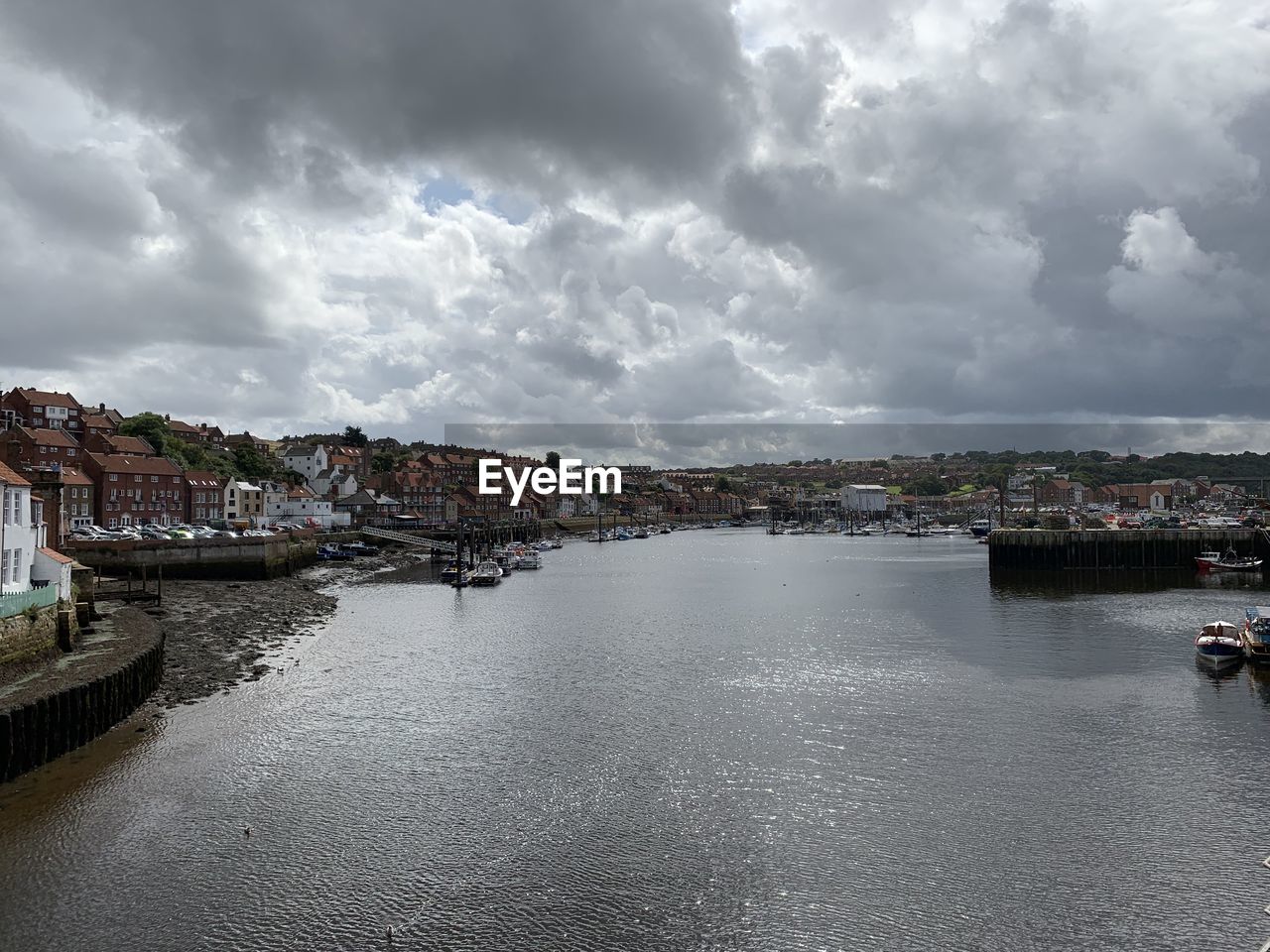 Panoramic view of river and buildings against sky
