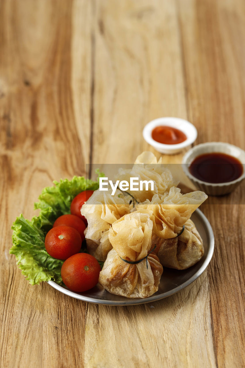 Wonton, oriental deep fried wontons filled with shrimp and spring onion, 