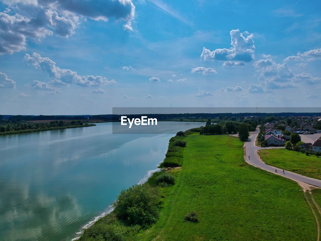 PANORAMIC VIEW OF LAKE AND TREES AGAINST SKY